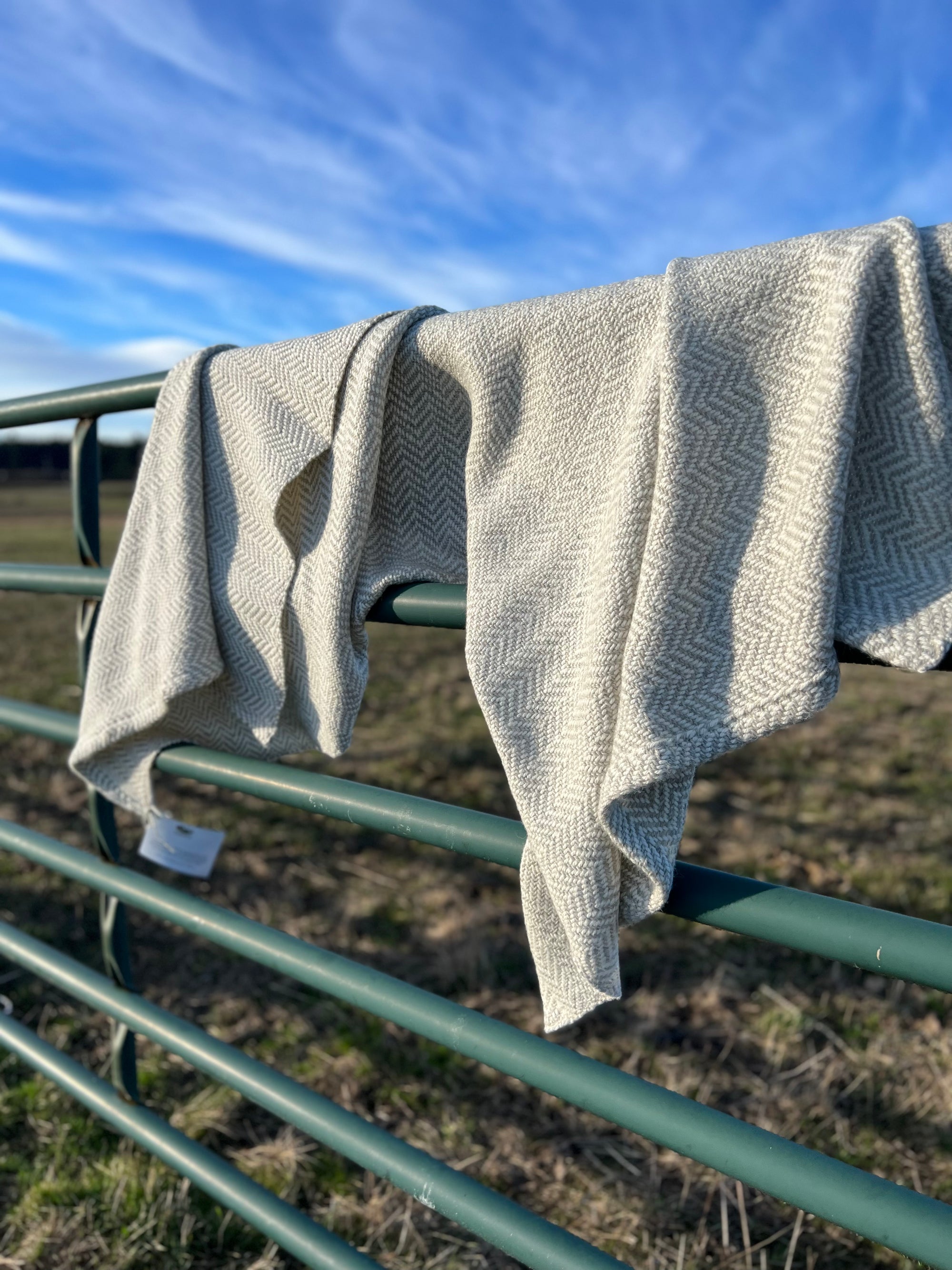 Chunky Blanket With Sewn Hem in White/Gray Herringbone.