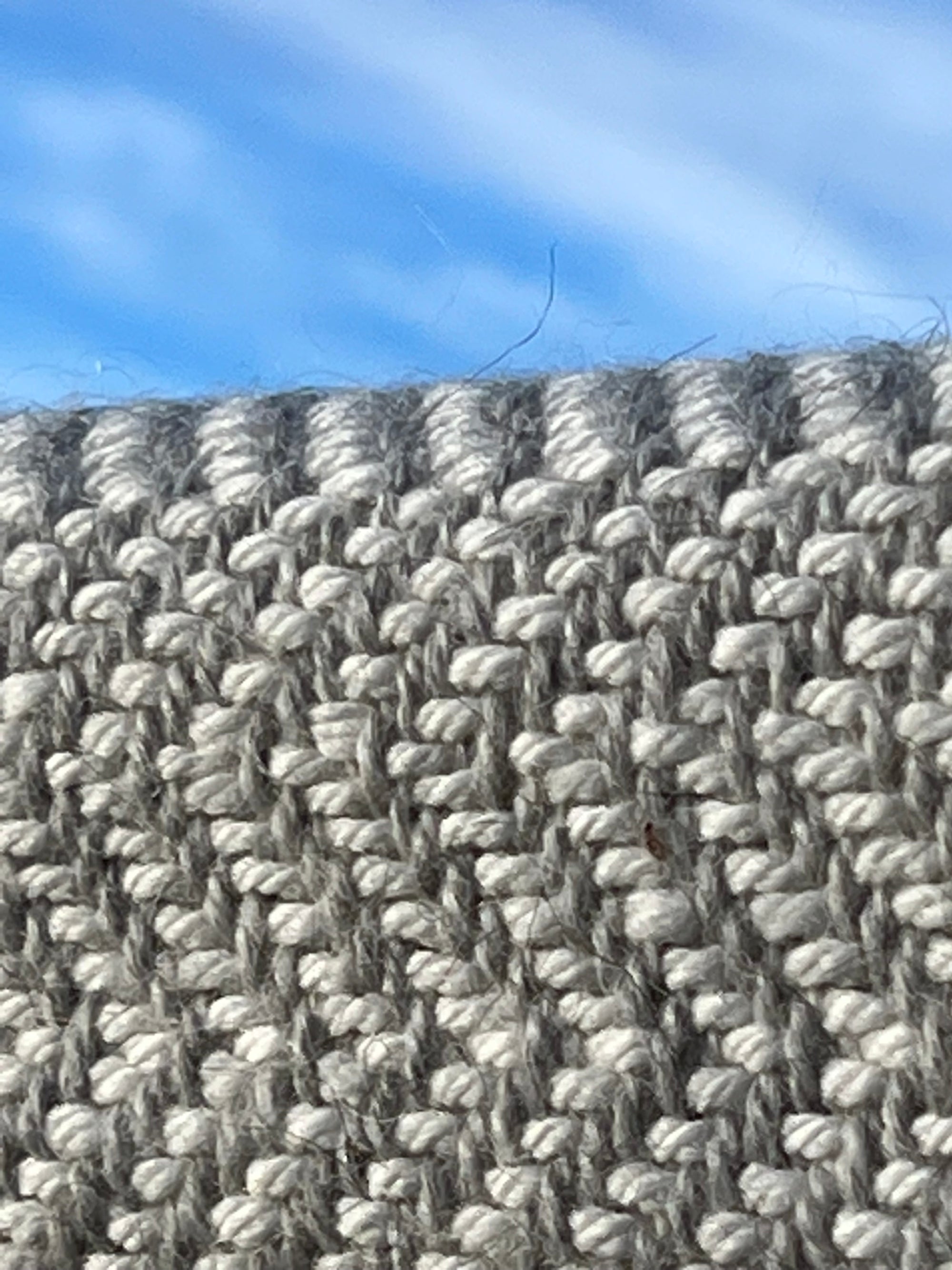 Chunky Blanket With Sewn Hem in White/Gray Herringbone.