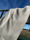 Chunky Blanket With Sewn Hem in White/Gray Herringbone.
